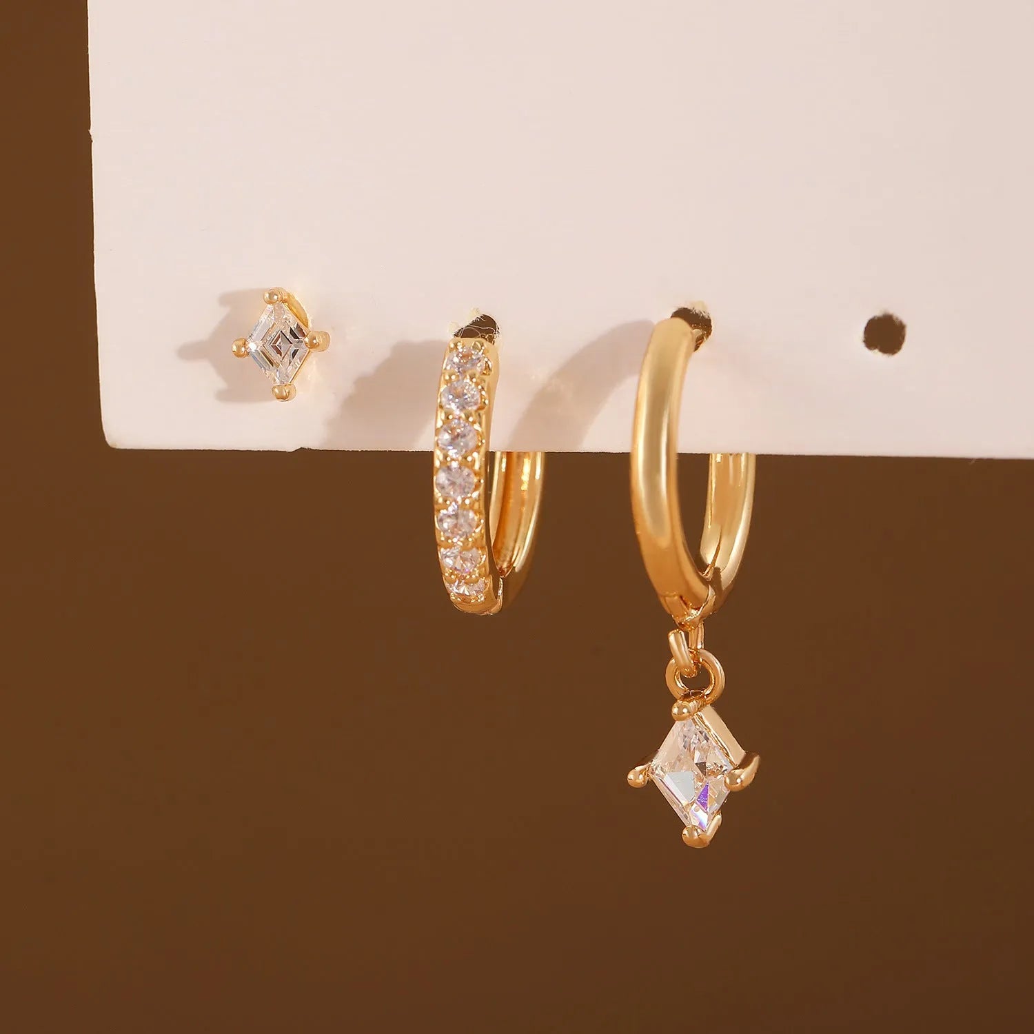Three-piece ladies earring set with geometric zircon patterns on copper in gold and white colours