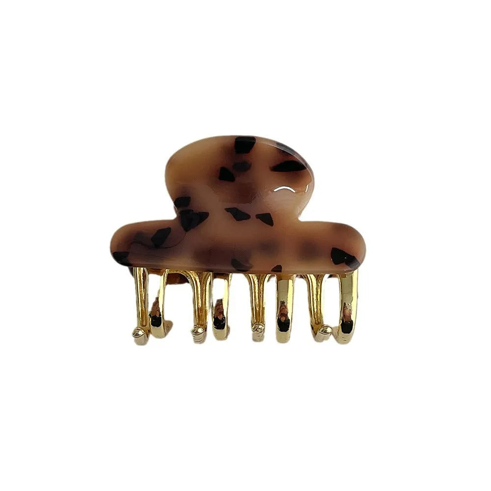 Medium acetate women's hair barrette with metal grip in leopard print retro design