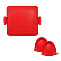 Red silicone baking tray with heat-resistant gloves on kitchen counter