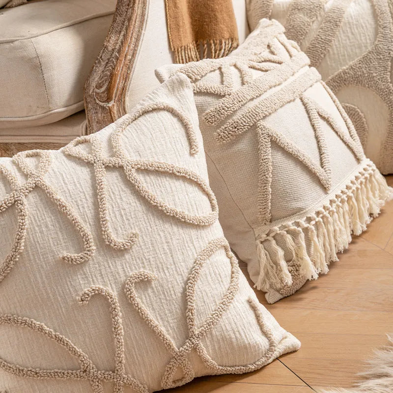 Knitted cushion cover with tassel trim in a striped pattern, shown in a choice of colours including spiral dots and woven rabbit fur.