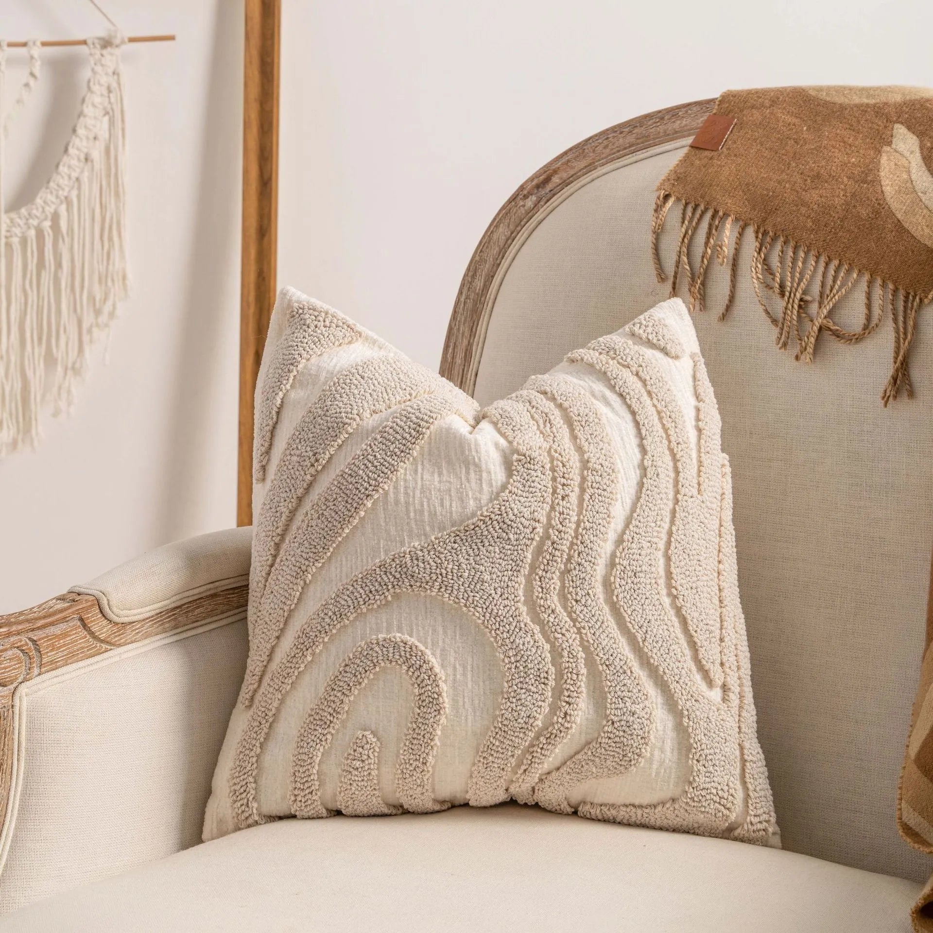 Knitted cushion cover with tassel trim in a striped pattern, shown in a choice of colours including spiral dots and woven rabbit fur.
