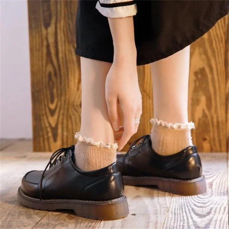 Women's black retro Mary Jane pumps with square heel and front lace-up closure