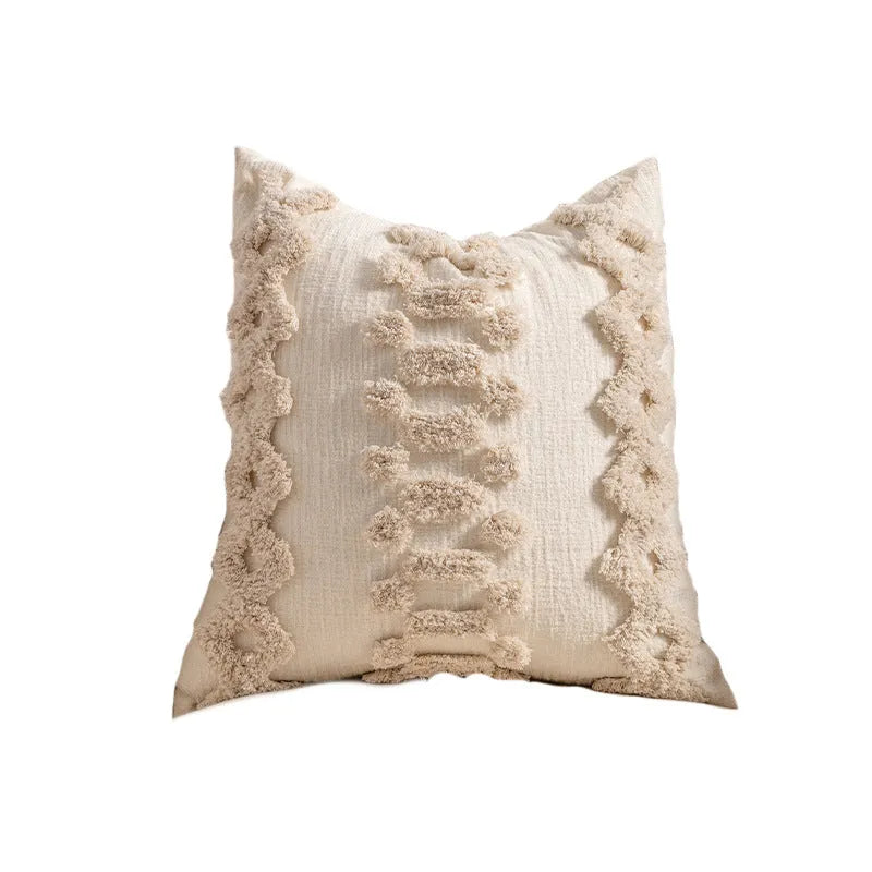 Knitted cushion cover with tassel trim in a striped pattern, shown in a choice of colours including spiral dots and woven rabbit fur.