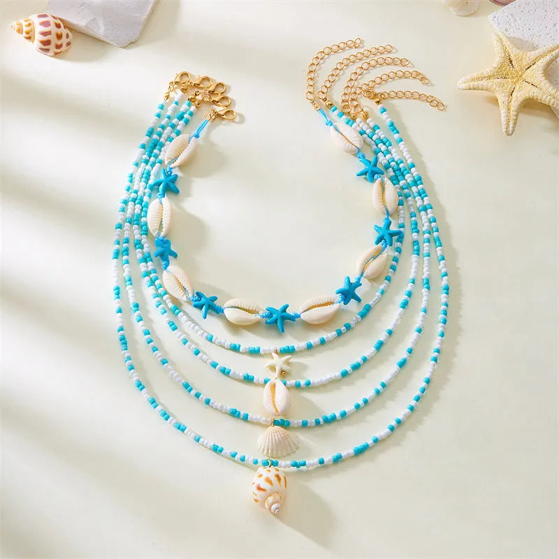 Multi-layer women's necklace with starfish shell pendants on adjustable bead chain