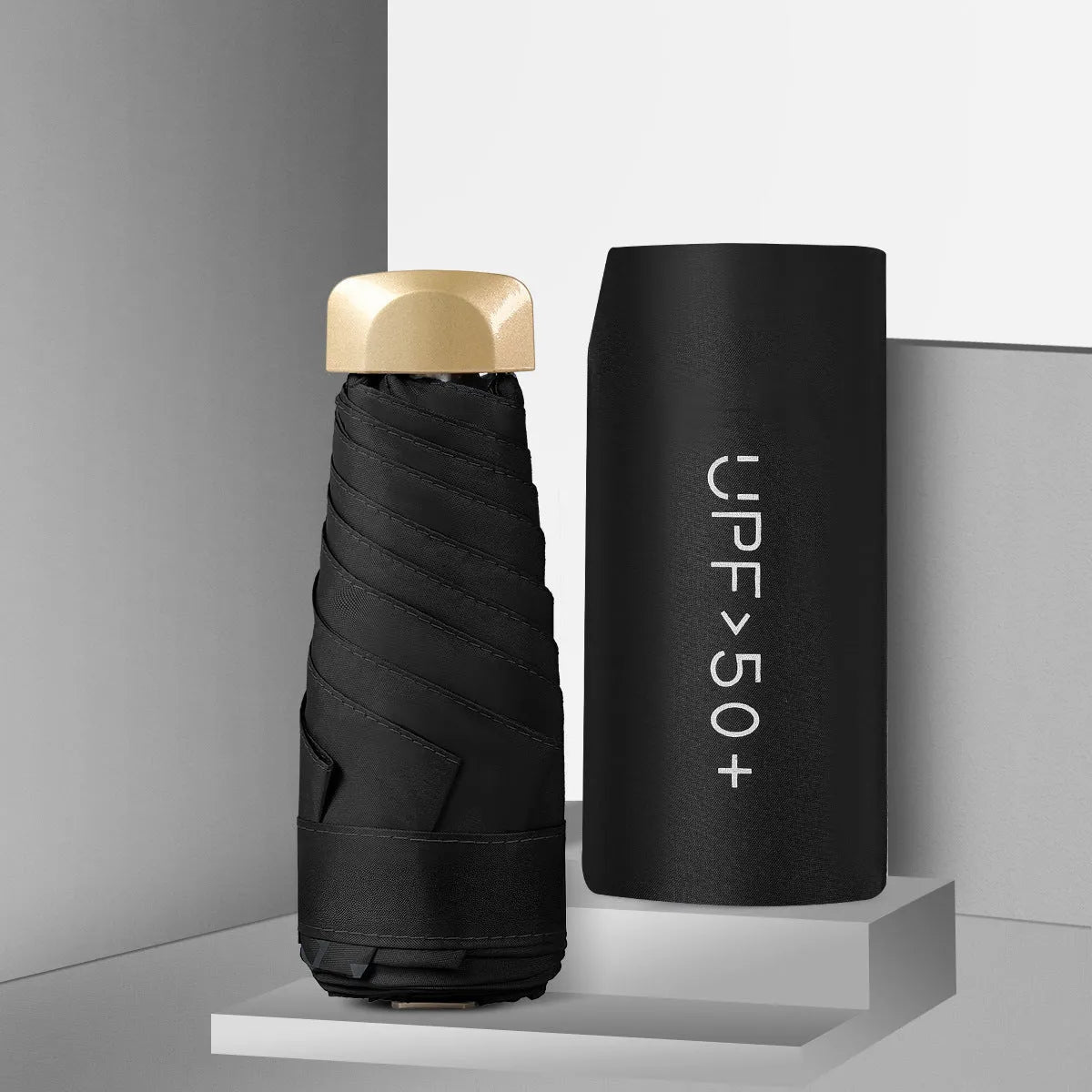 Closed five-fold mini pocket sun umbrella showing compact size and rubber handle