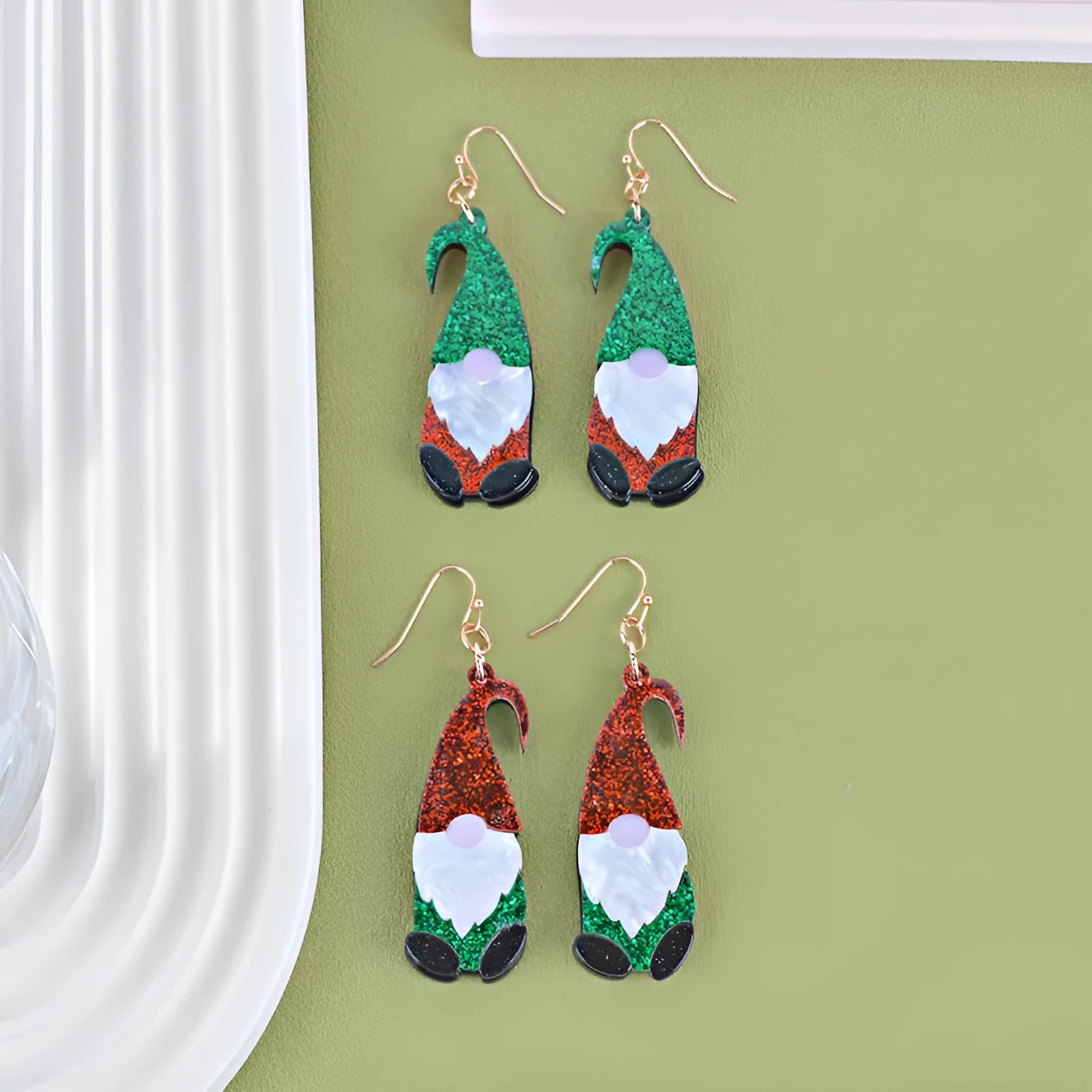 Pair of festive red and green Santa Claus cartoon character acrylic fashion earrings.
