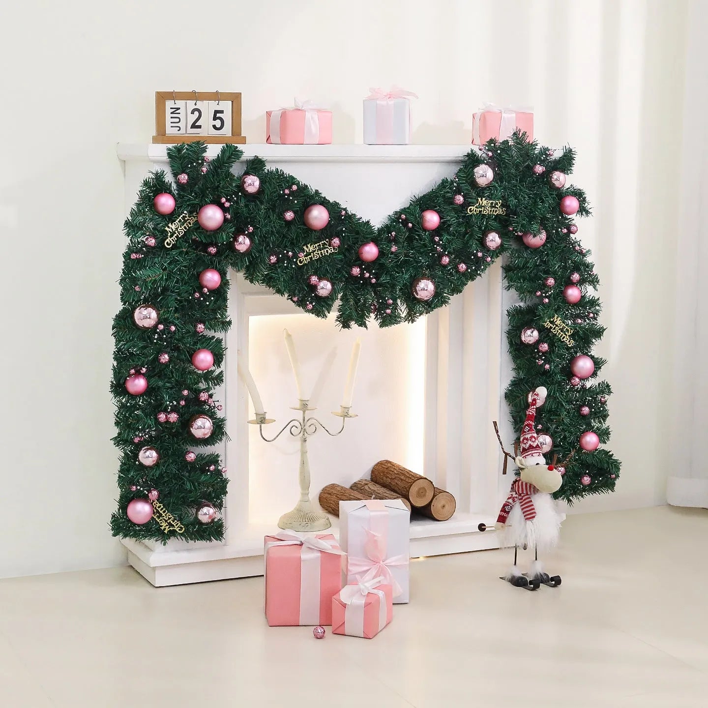 2.7 metre pink small fruit Christmas rattan garland with wrought iron frame draped along wall