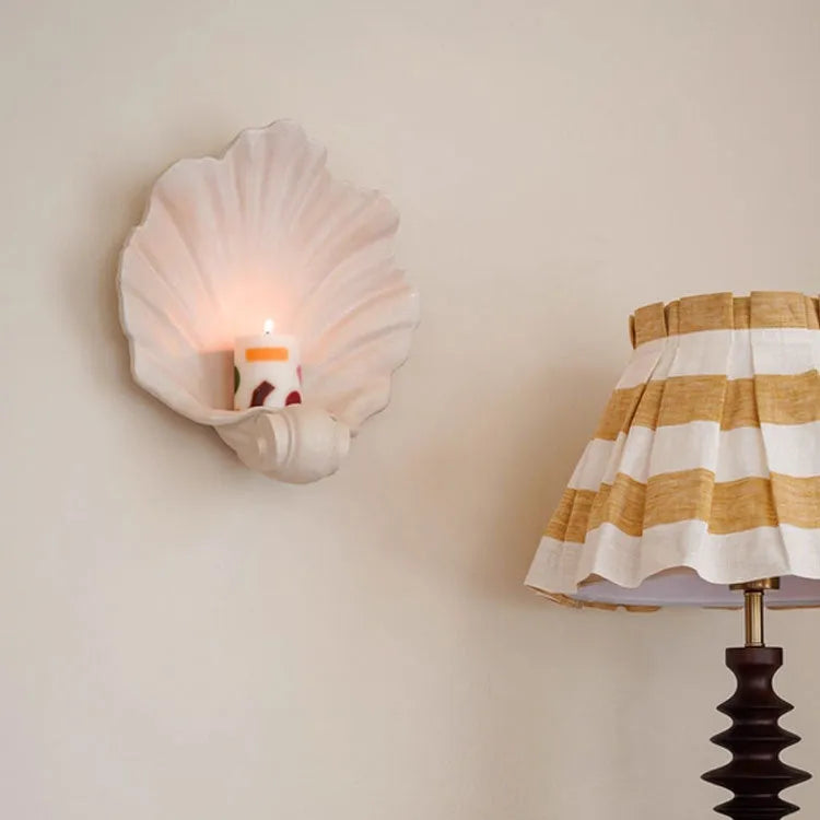 White resin simulation shell fruit plate ornament on a table