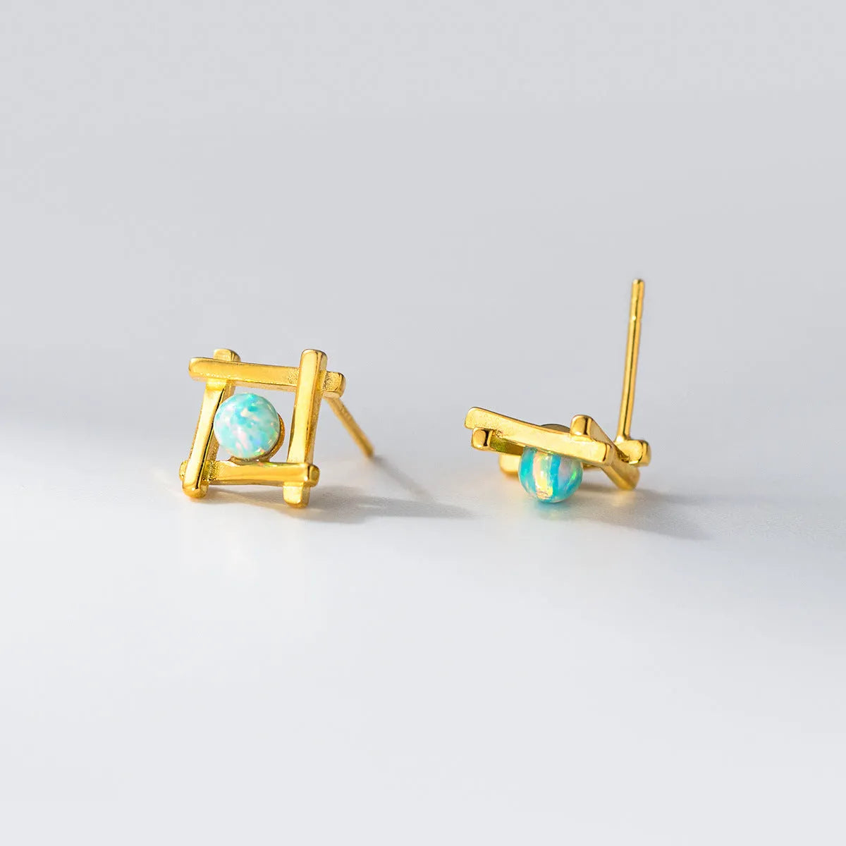 Women's geometric cross quadrangle stud earrings in 925 silver with gold and silver finish options