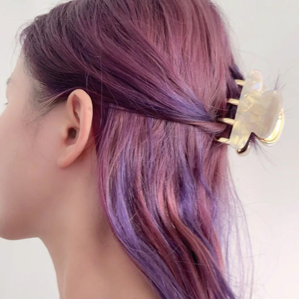 Medium acetate women's hair barrette with metal grip in leopard print retro design