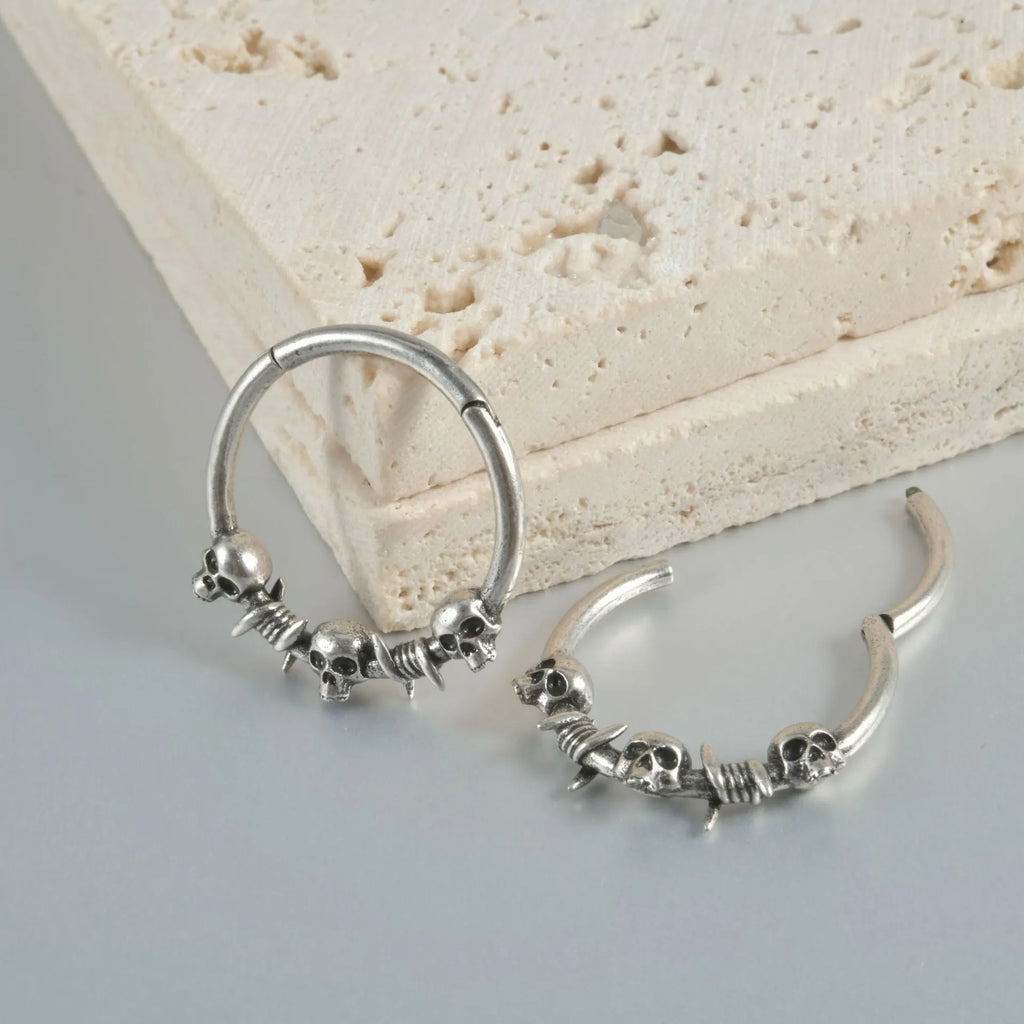 Punk copper earrings with antique ghost head designs in gold and silver finishes