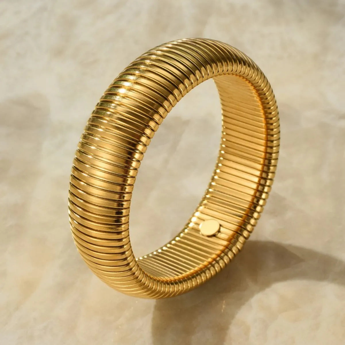 Women's gold elastic titanium steel bracelet with exaggerated vertical stripe ring pattern