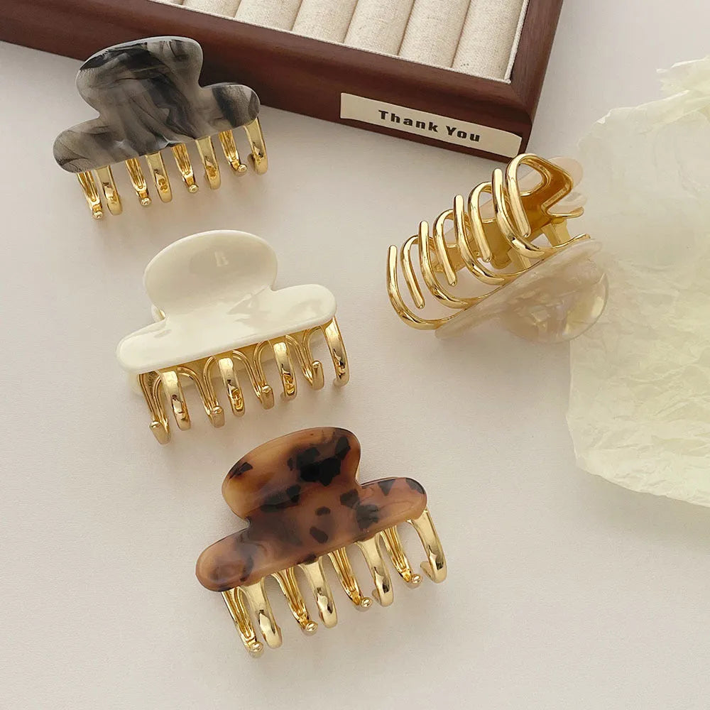 Medium acetate women's hair barrette with metal grip in leopard print retro design