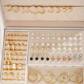 108 gold and yellow geometric alloy pearl earrings arranged in a set.