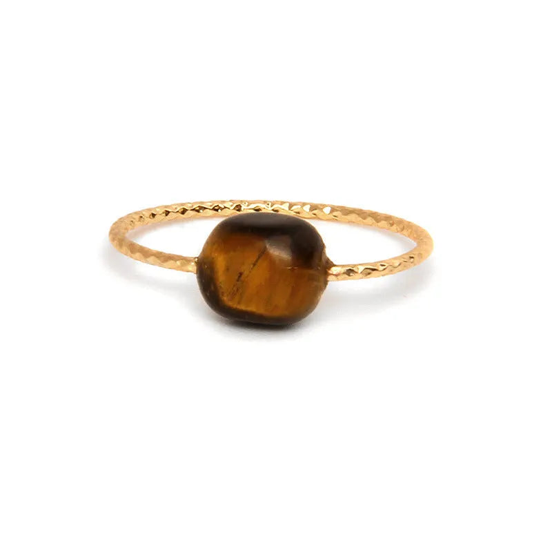 Geometric shaped agate ring for women on a hand, showing original design and coloured stone.