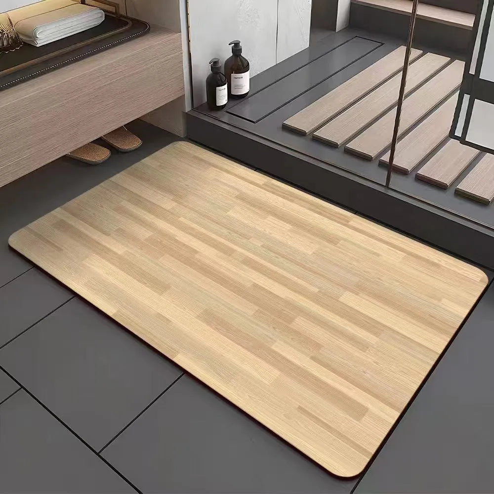 Square diatom mud bathroom floor mat with a brown wood grain geometric pattern on a tiled floor.