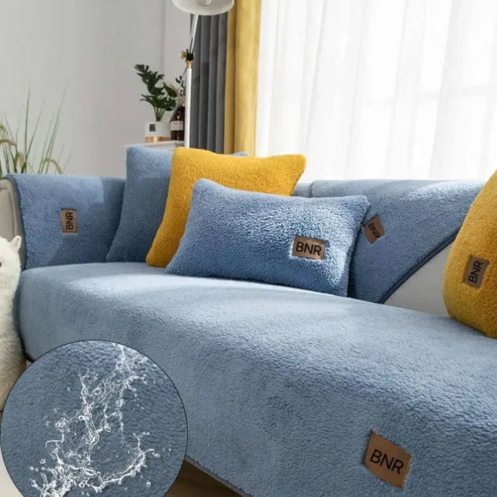 Solid colour lambswool sofa cover on a couch with matching pillow cover.