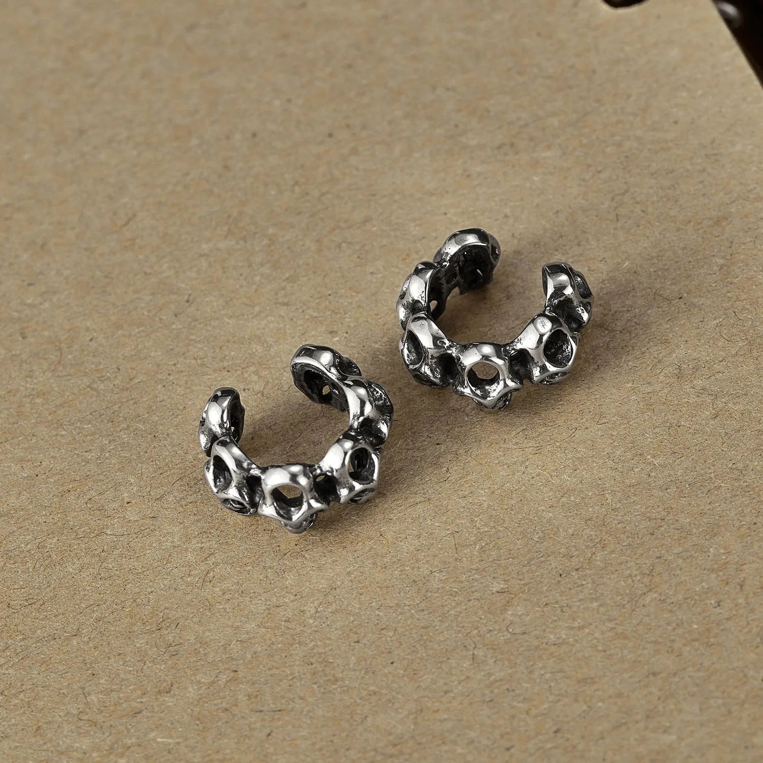 Retro geometric hollow skull earrings with steel clip, stainless steel construction with electroplated finish