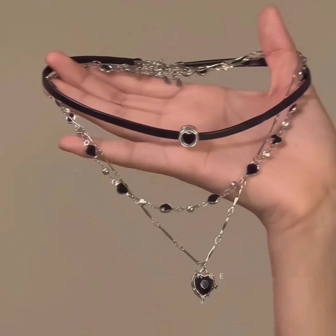 Women's multi-layer necklace set with adjustable leather heart pendants on alloy chain