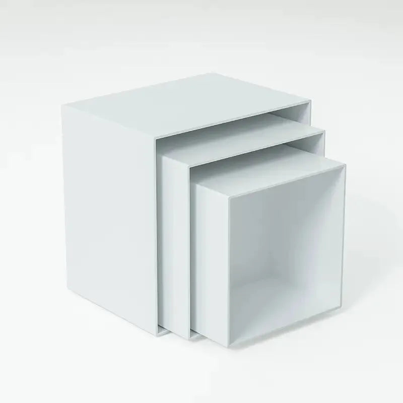 White plastic cube-style dessert display stand with six pieces for cupcakes and cakes.