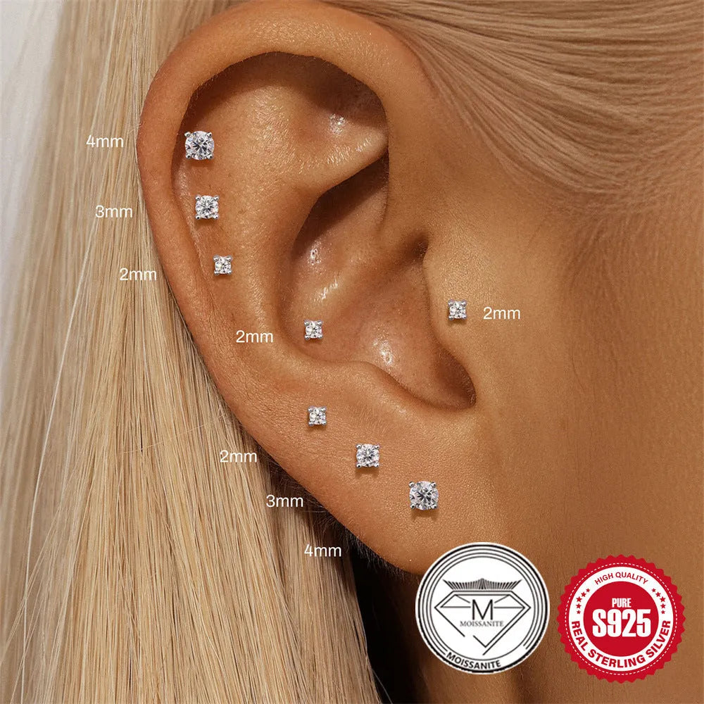 S925 sterling silver geometric stud earrings with petal diamond design, showing triangle and flower shapes.