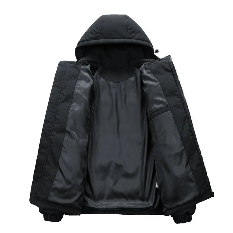 Man wearing a black hooded padded long coat with side pockets and a cardigan style.