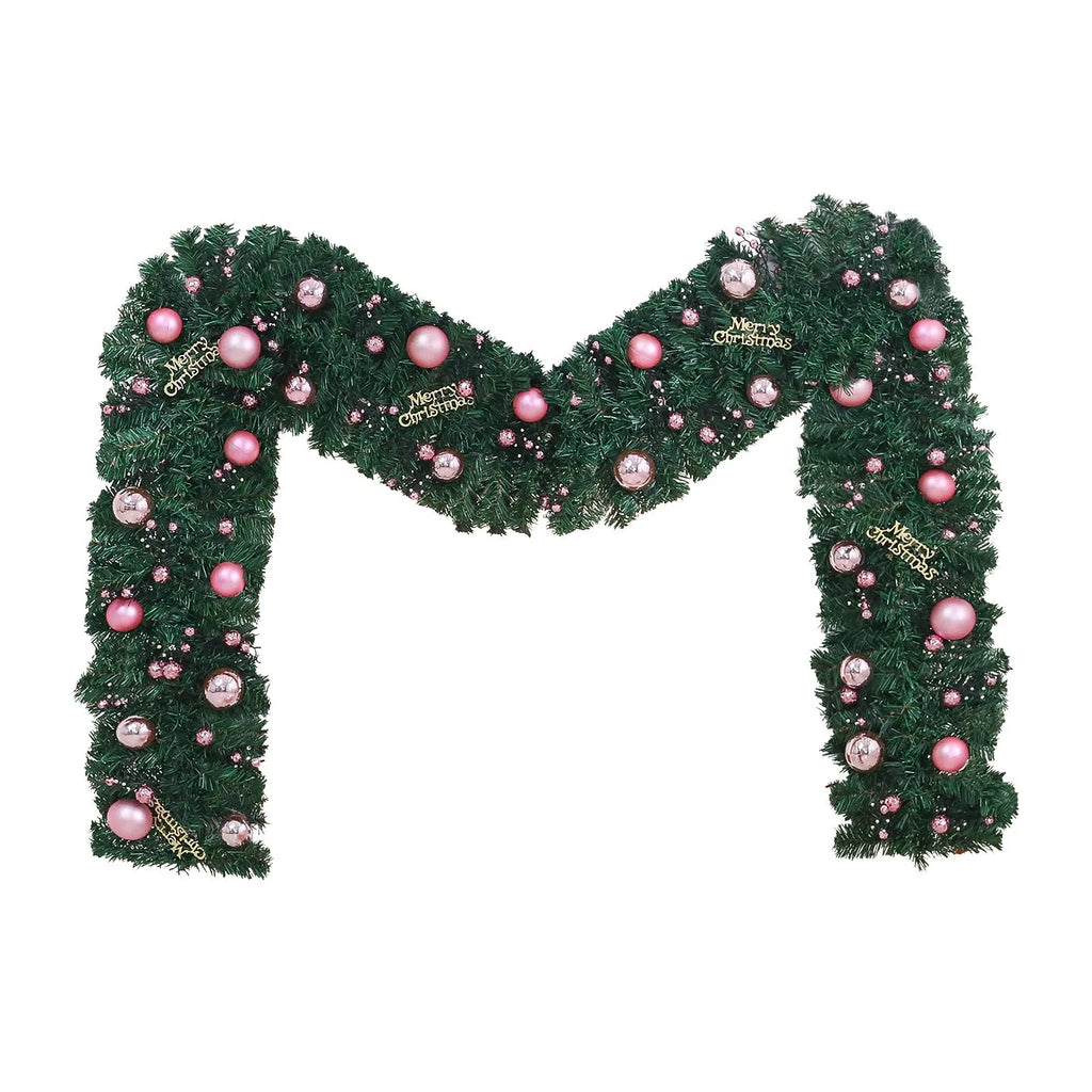 2.7 metre pink small fruit Christmas rattan garland with wrought iron frame draped along wall