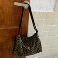 Leopard print shoulder messenger bag with stripe option and visible stitching details