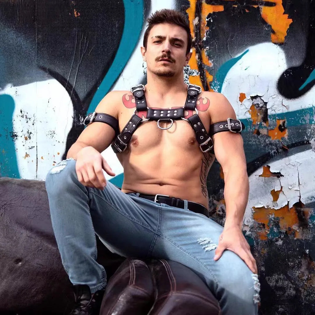 Black leather chest muscle bondage strap with metal buckle and adjustable shoulder design