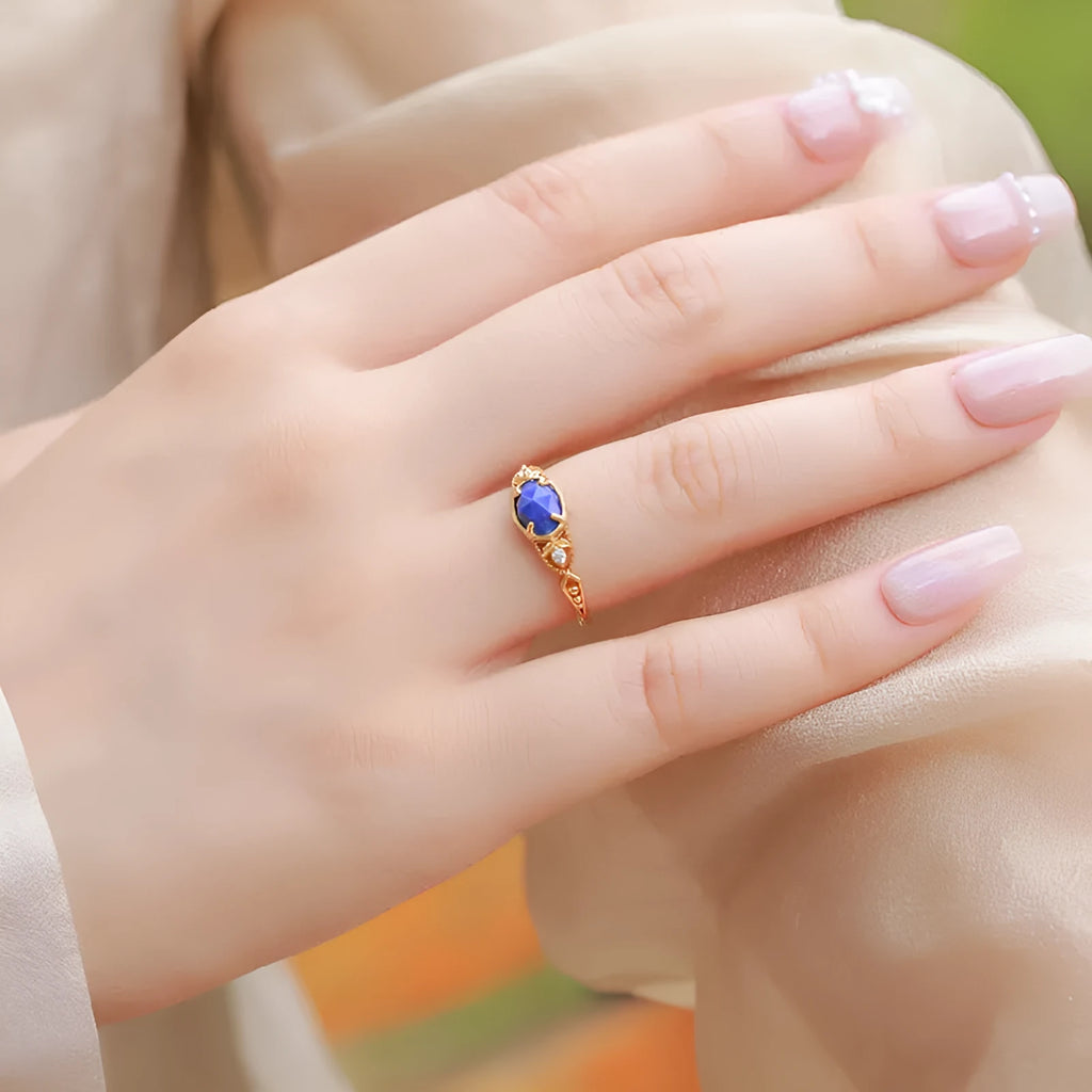 Women's oval geometric silver ring with deep blue lapis lazuli stone and round elements
