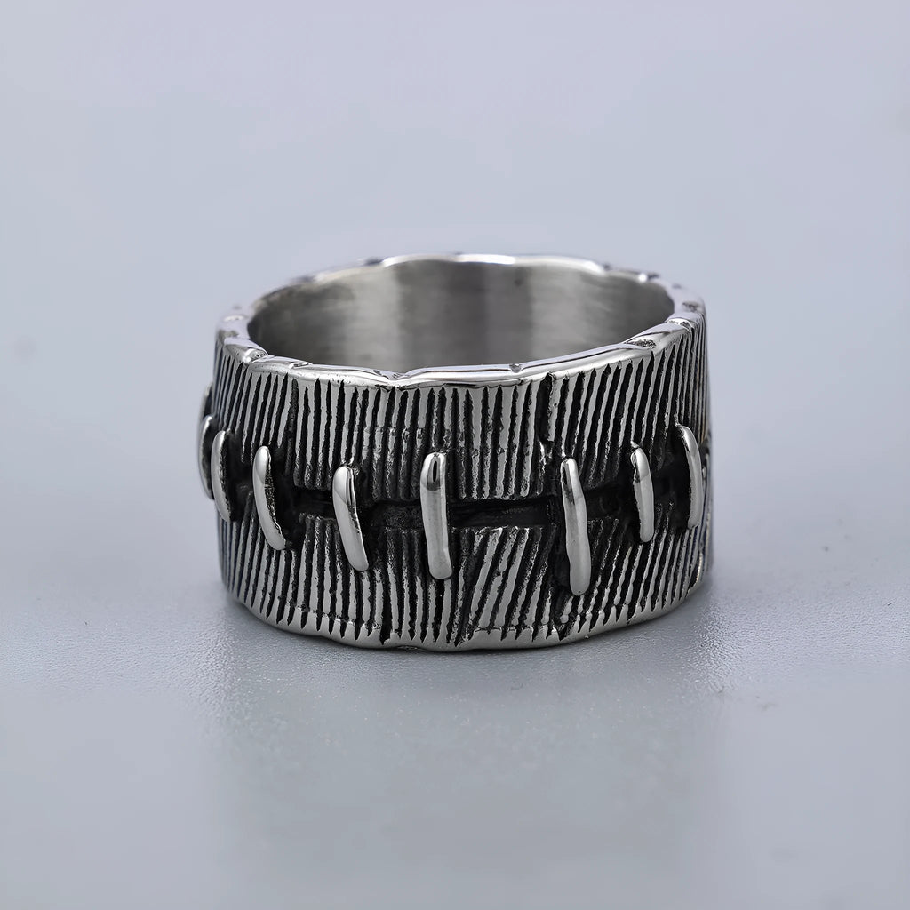 Geometric U-shaped titanium steel punk ring with double-ring design and stitched texture in black.