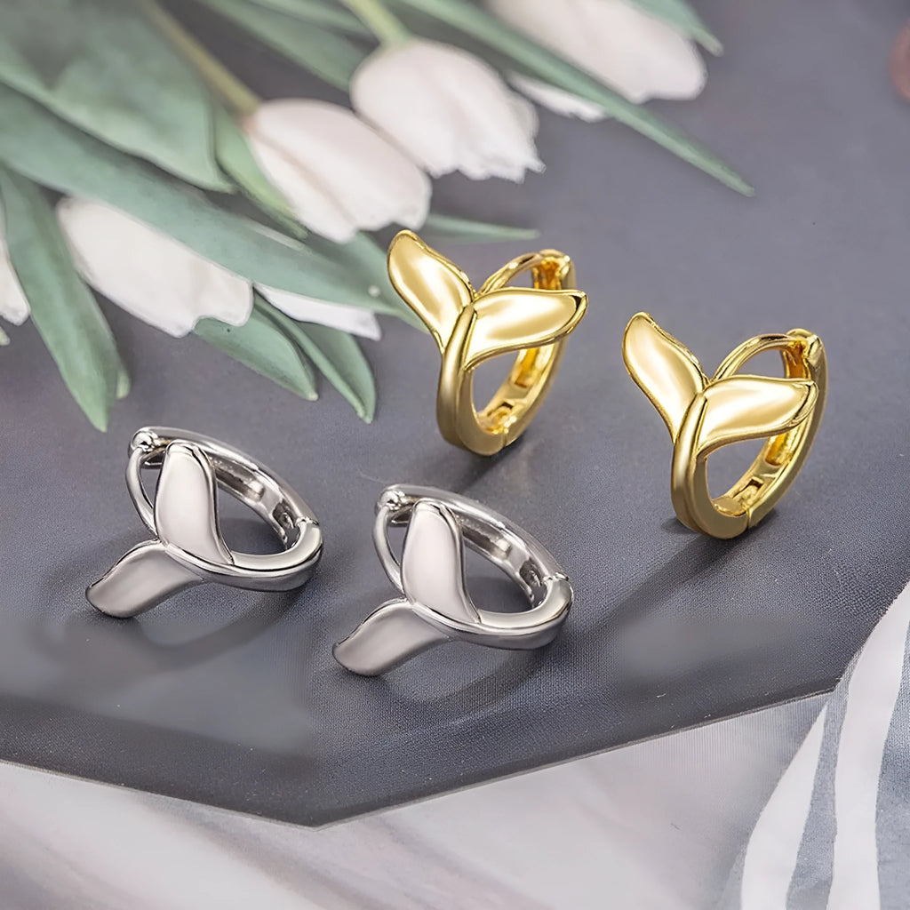 A pair of women's simple fishtail design earrings with an electroplated white gold or yellow gold finish.