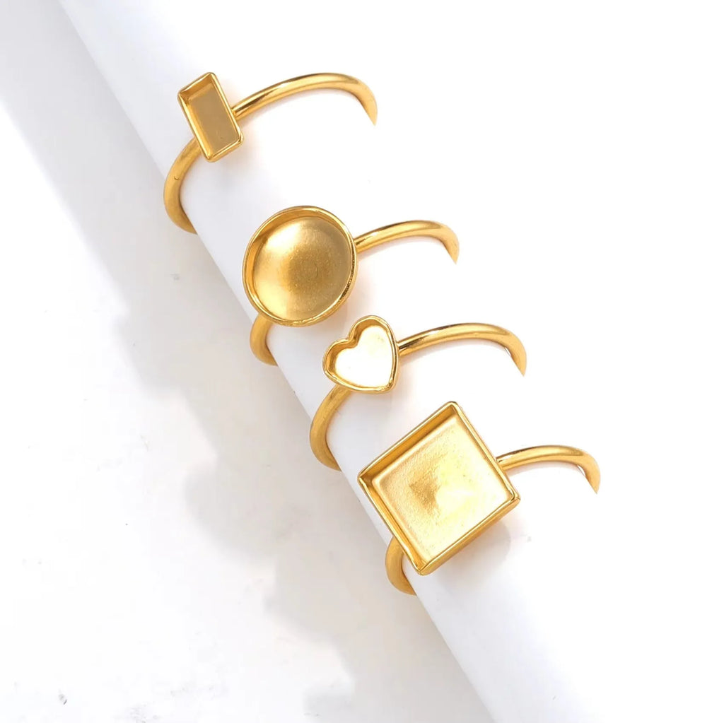 Golden electroplated stainless steel ring settings in various shapes with totem pattern texture and ring holder