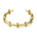Stainless steel bracelet with C-shaped bean bead charm featuring texture and rivet details.