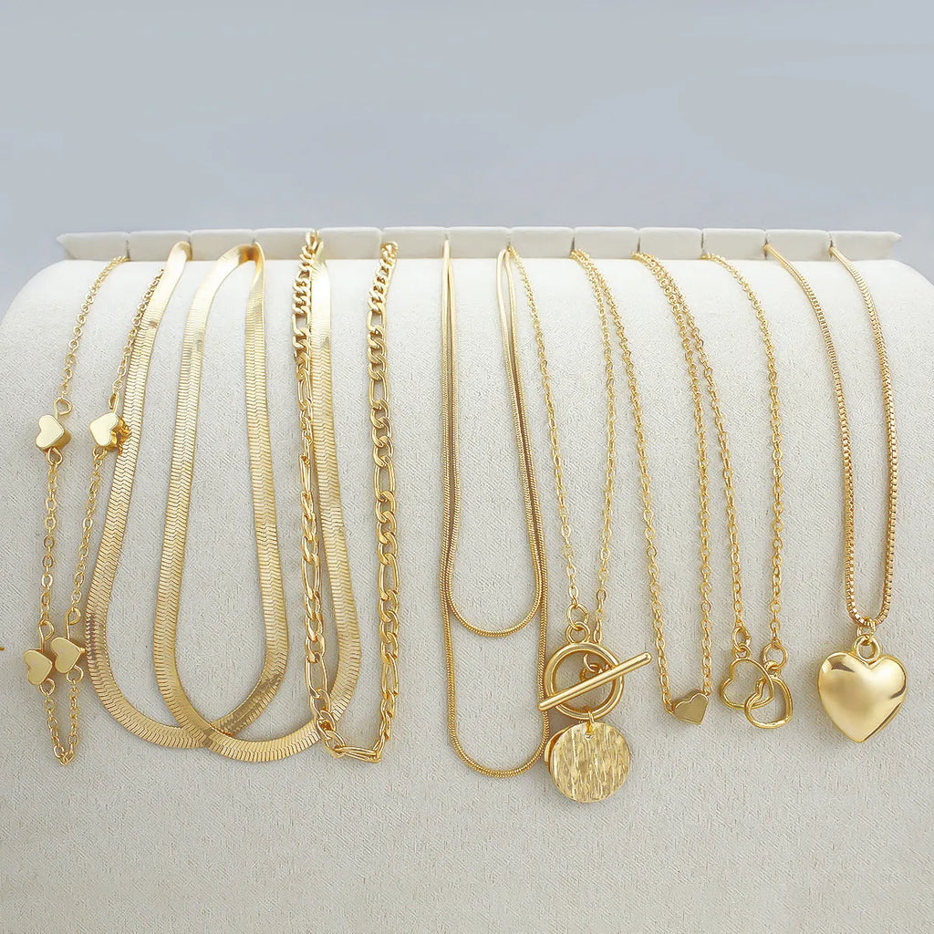 10-piece gold necklace set for women with adjustable snake bones chain and simple alloy pendants