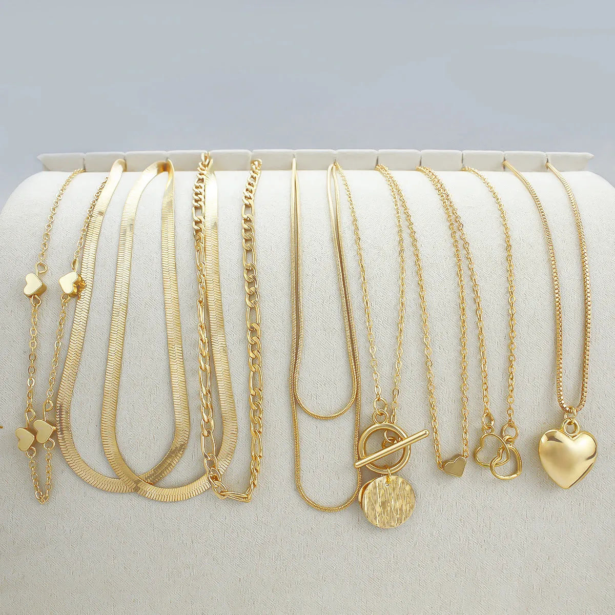 10-piece gold necklace set for women with adjustable snake bones chain and simple alloy pendants