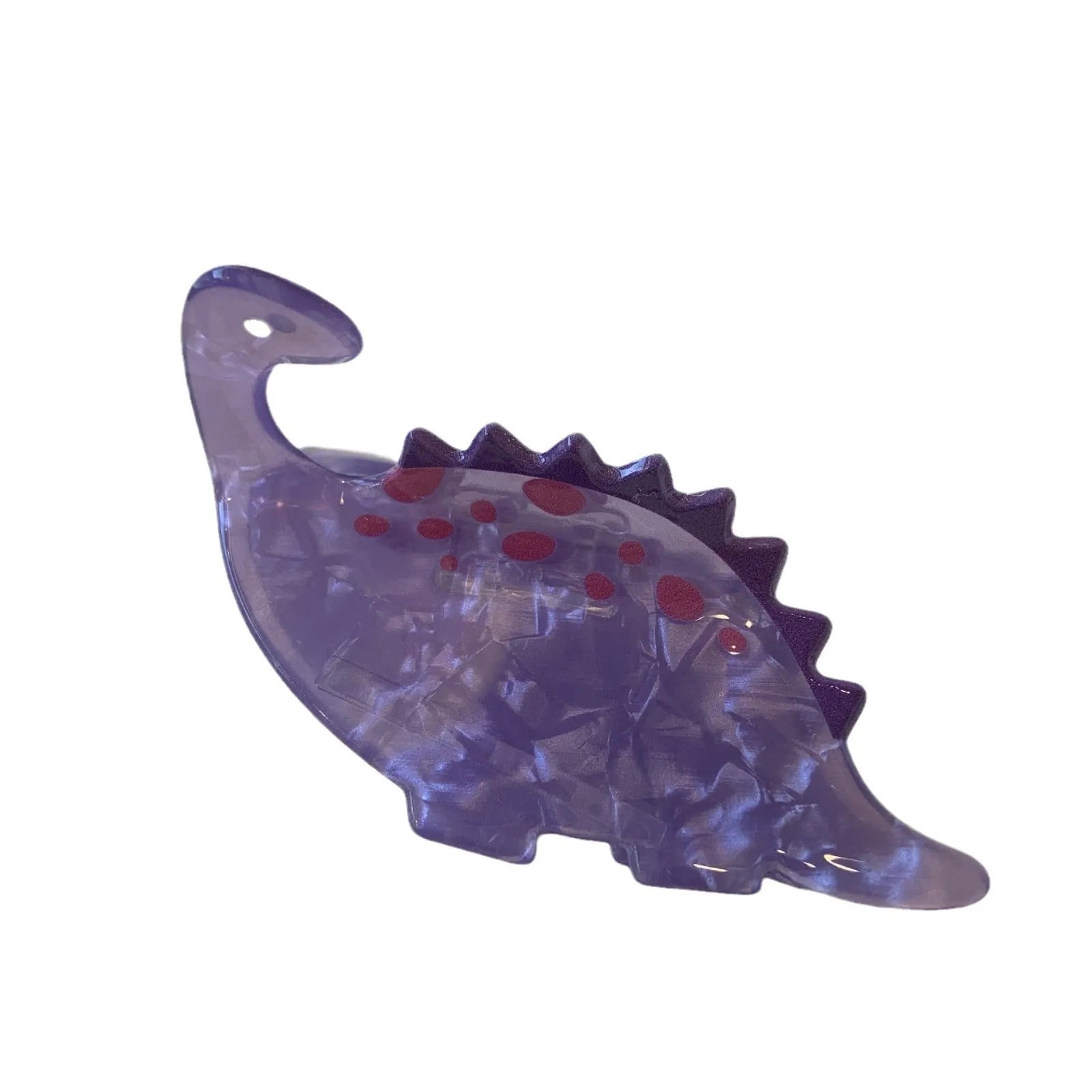 Acrylic dinosaur jaw clip hairpin showing one of six colour designs: Pink Pterosaur, Green Stegosaurus, Purple Dragon, Blue Dinosaur, Brown Tyrannosaurus, or Green Chameleon.