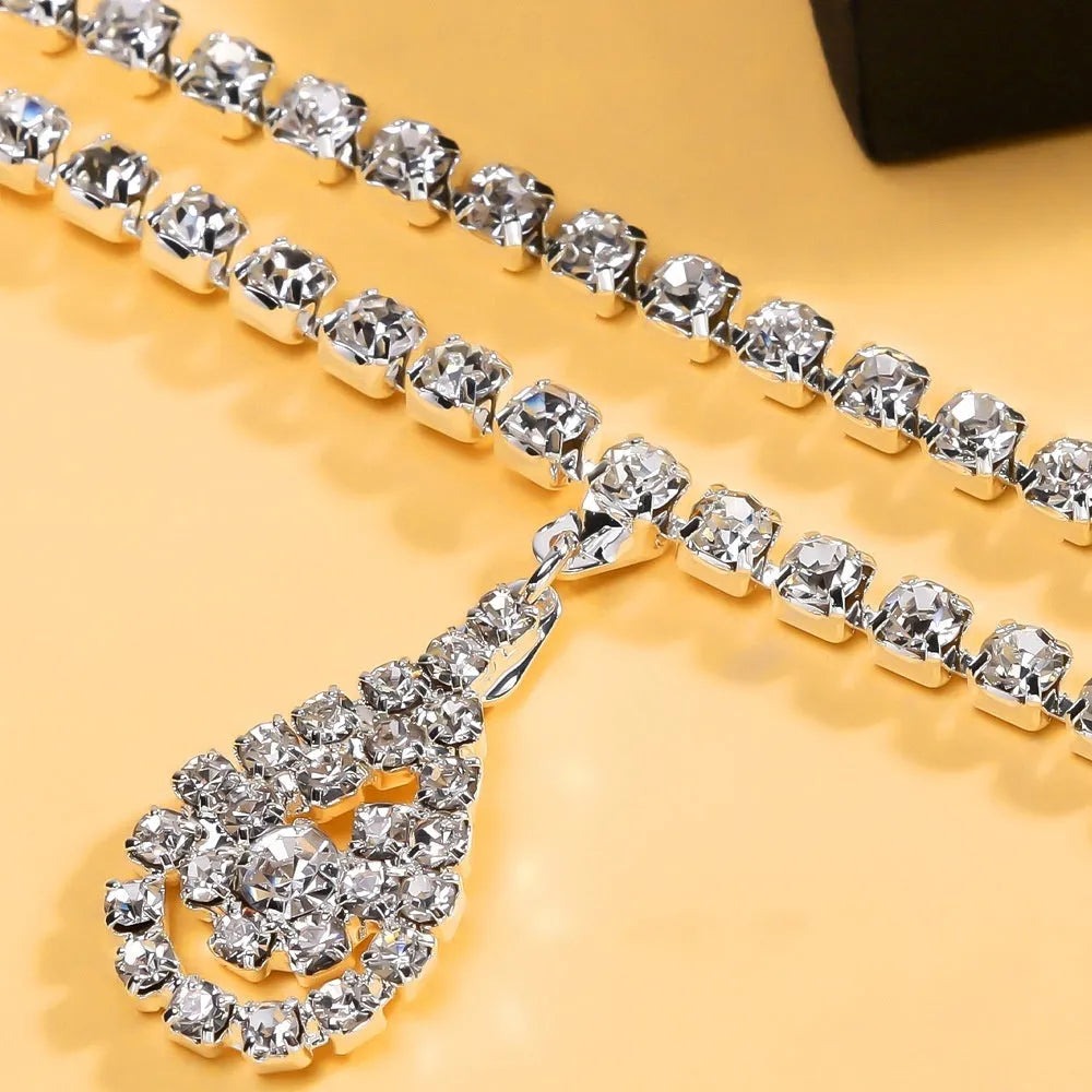 Gold or silver rhinestone waist chain with water drop pendant and tassel detail