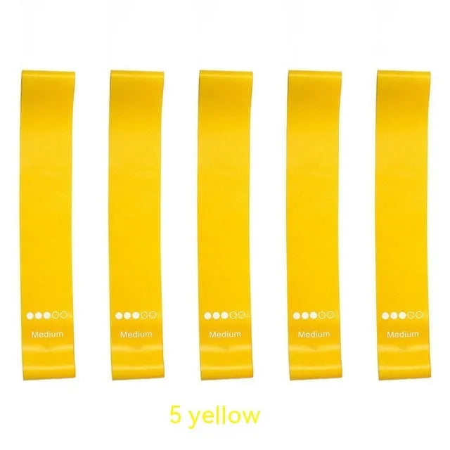 Five colour-coded TPE yoga tension straps with graduated thickness for resistance training