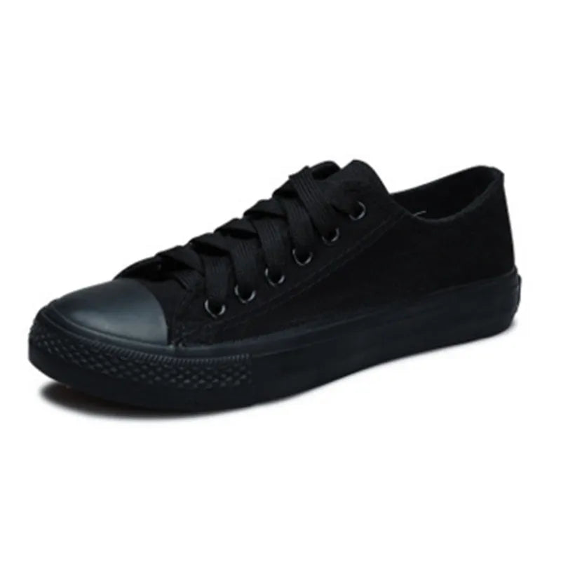 Solid colour women's casual canvas slip-on shoes on a white background, showing the simple design and canvas upper material.