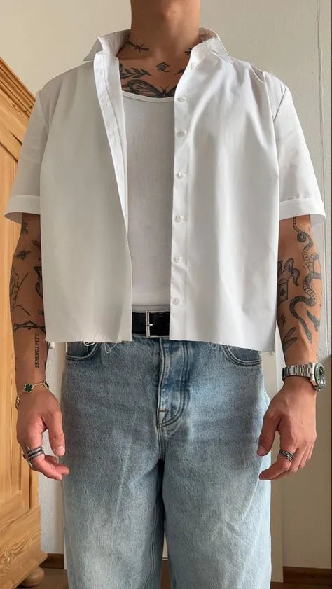 Men's white cropped short sleeve polyester shirt laid flat, showing its regular fit and plain design.