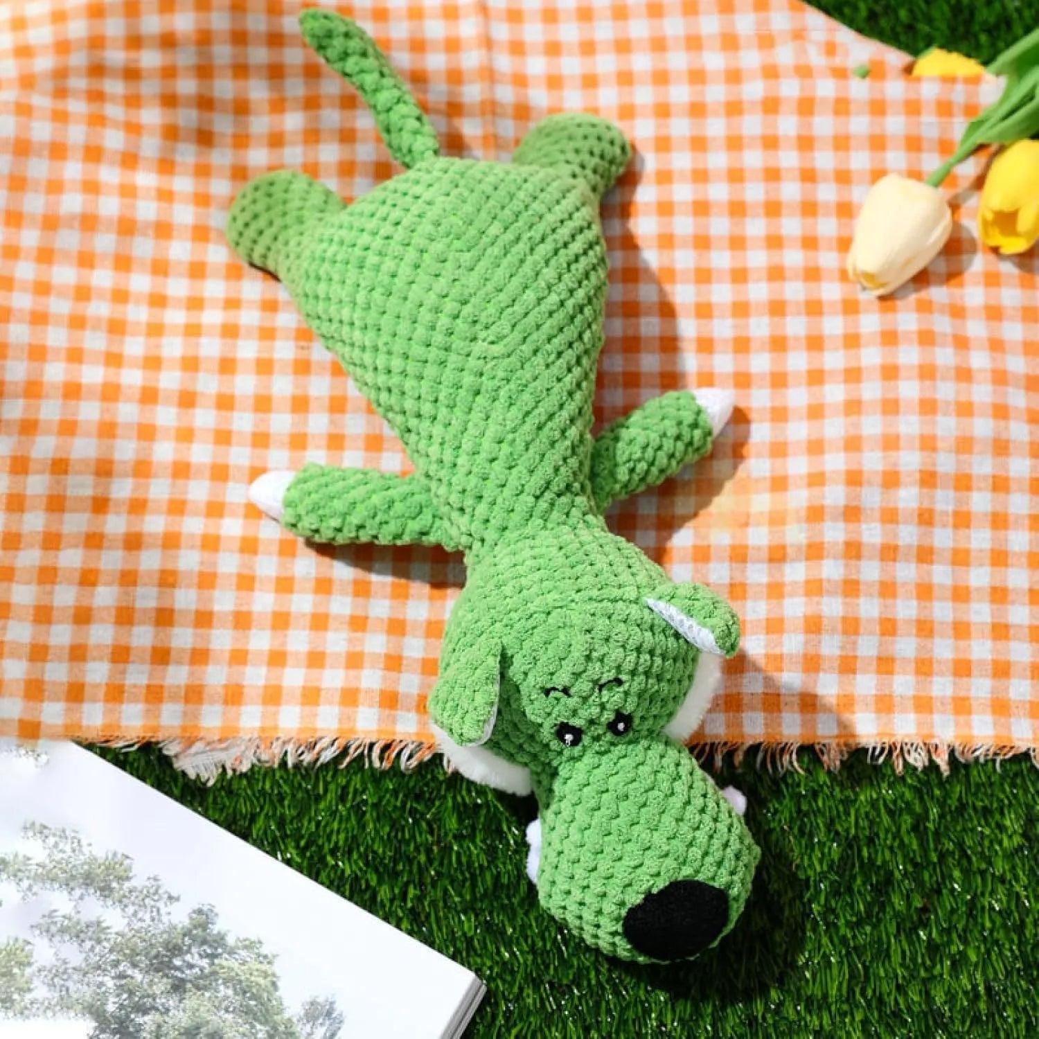Four plush dog chew toys in green, grey and yellow with corn kernel texture design