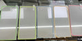 Fluorescent tempered glass screen protector for iPhone showing luminous pink, yellow, green, blue and grass green colour options.