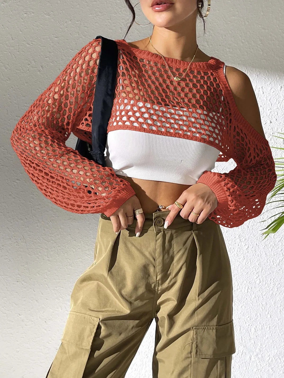 Mesh beach shirt with a hollowed navel section shown in multiple colour options.