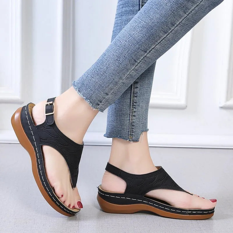 Women's casual wedge heel flip flop sandals with an adjustable back strap in solid colours.
