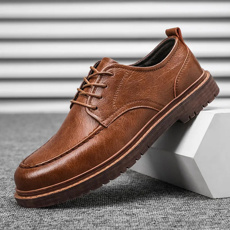 Men's brown casual leather slip-on shoes with round toe and flat rubber sole