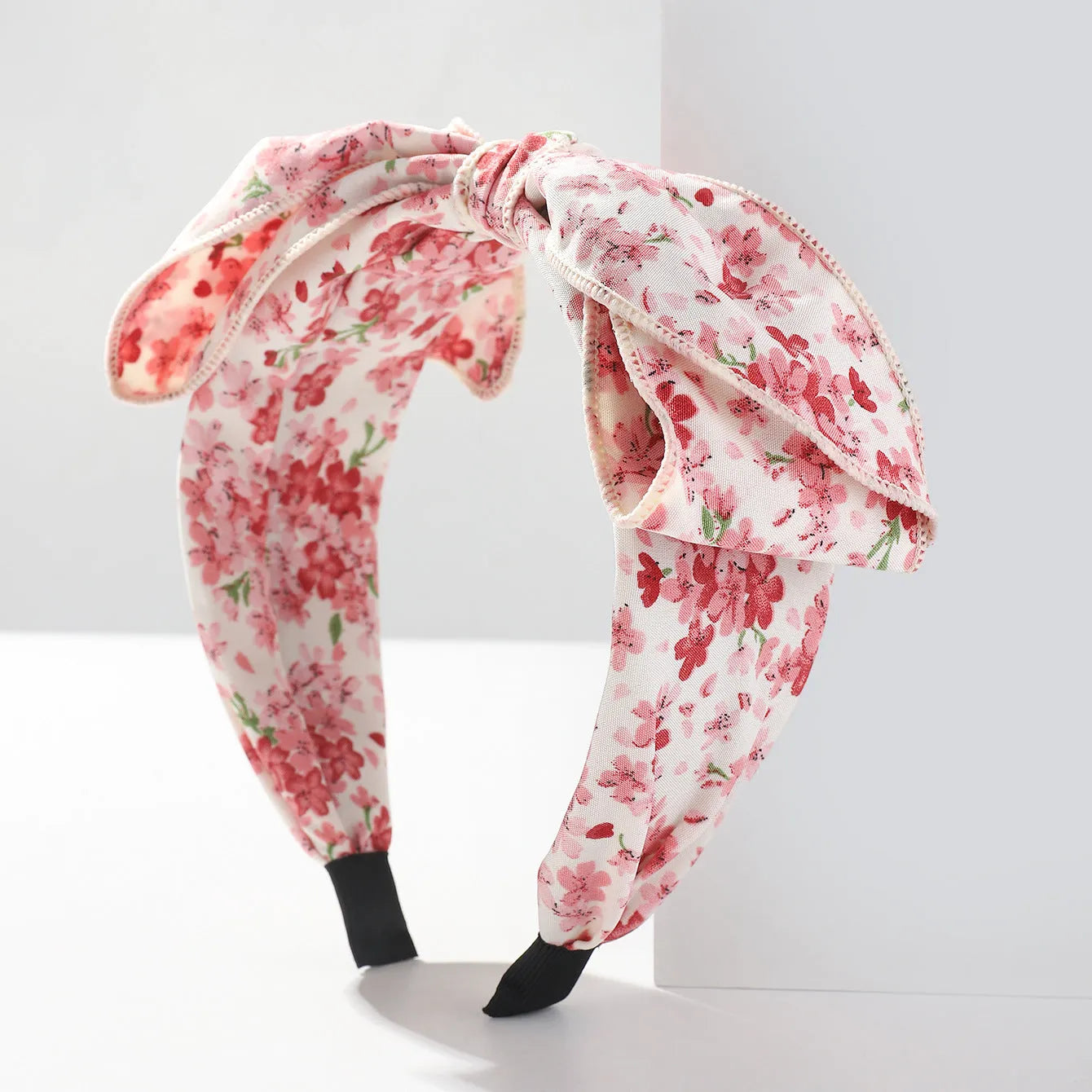 Handmade cloth hair bow with printed orchid and daisy flowers in pastoral style for women
