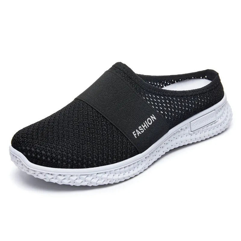 Women's breathable mesh casual shoes with hollow-out design and flat heel in round toe style.
