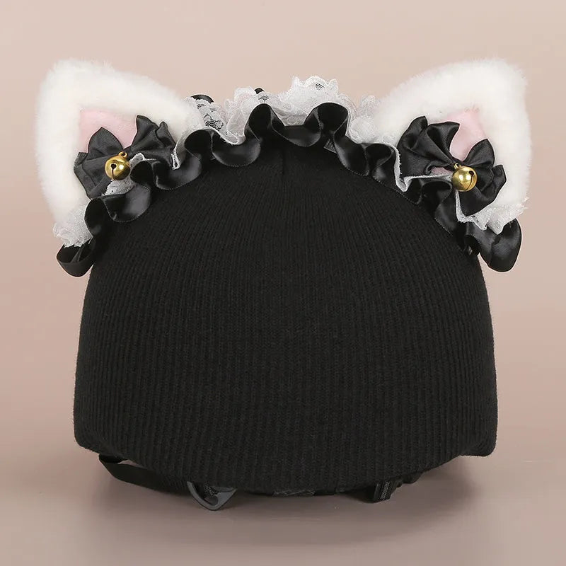 A plush fabric cartoon character helmet hat cover with attached ears on a white background.