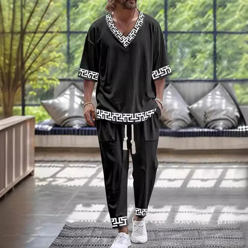 Polyester cropped sleeve V-neck jacket and trousers suit set on a hanger.